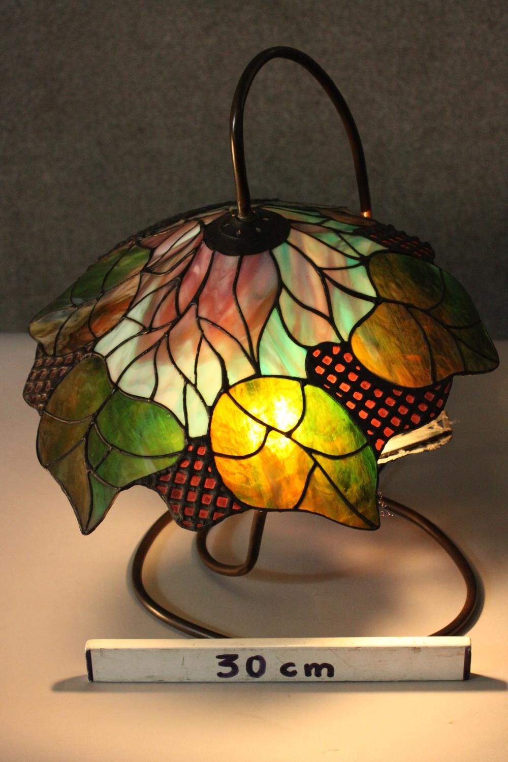 A Tiffany style stained glass table lamp, the shade with foliate design. H.48 W.40cm. - Image 8 of 8