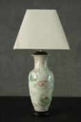 A 20th century Chinese ceramic vase converted to a table lamp. Decorated with mandarin ducks and