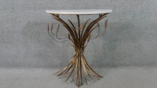 A wheatsheaf demi-lune console table, with a white marble top, on a gilt metal base. H.75 W.70 D.