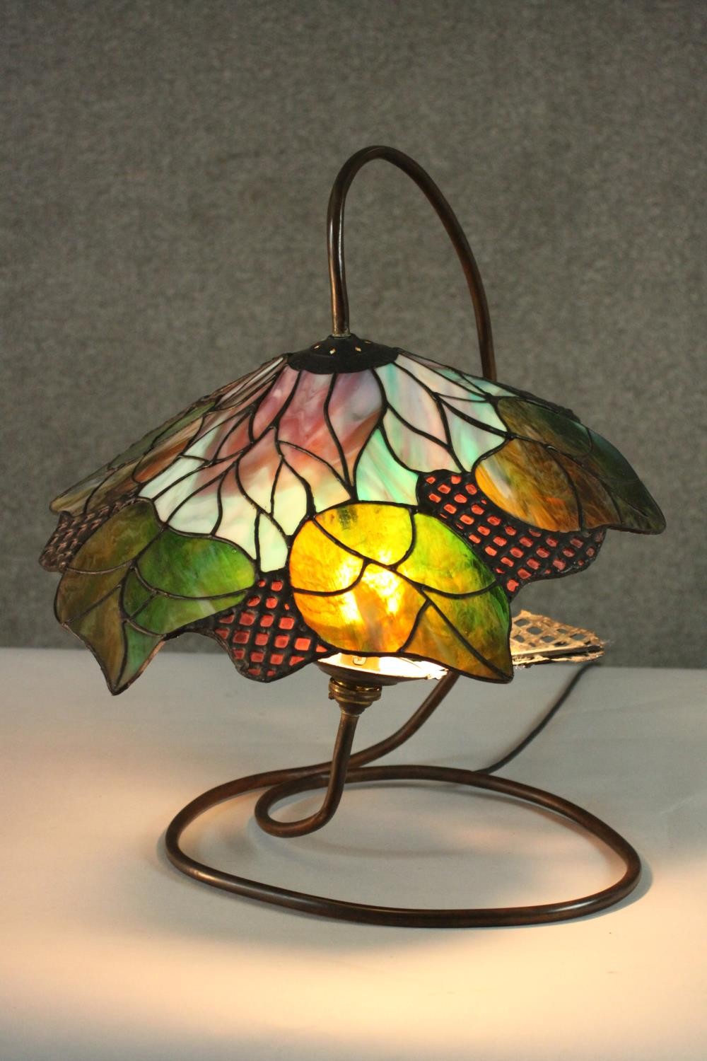 A Tiffany style stained glass table lamp, the shade with foliate design. H.48 W.40cm. - Image 2 of 8