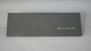 A boxed vintage Bulgari pale blue and yellow abstract design silk tie, with makers label.