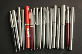 A collection of seventeen vintage fountain and ballpoint pens, makers including Parker and Sheaffer.