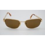 A cased set of vintage Bulgari gold plated and tortoiseshell plastic tinted sunglasses, with lens