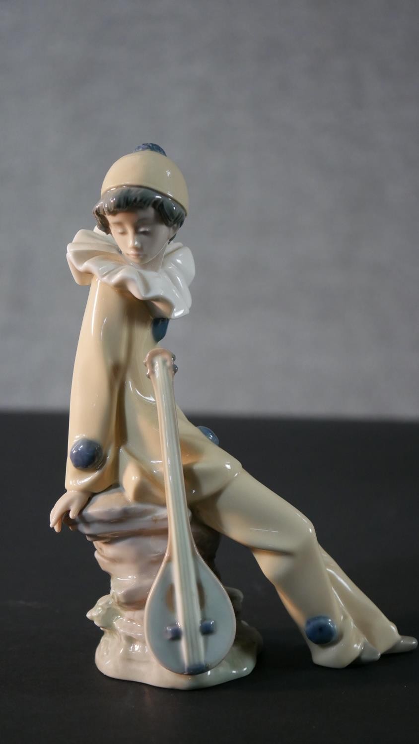 A collection of porcelain figures. Four Nao figures, a girl holding a cake with her dog , a clown, a - Image 5 of 13