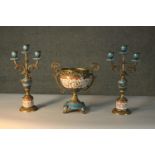 Two brass and hand painted ceramic candelabras and a twin handled bowl. Makers mark to the base. H.