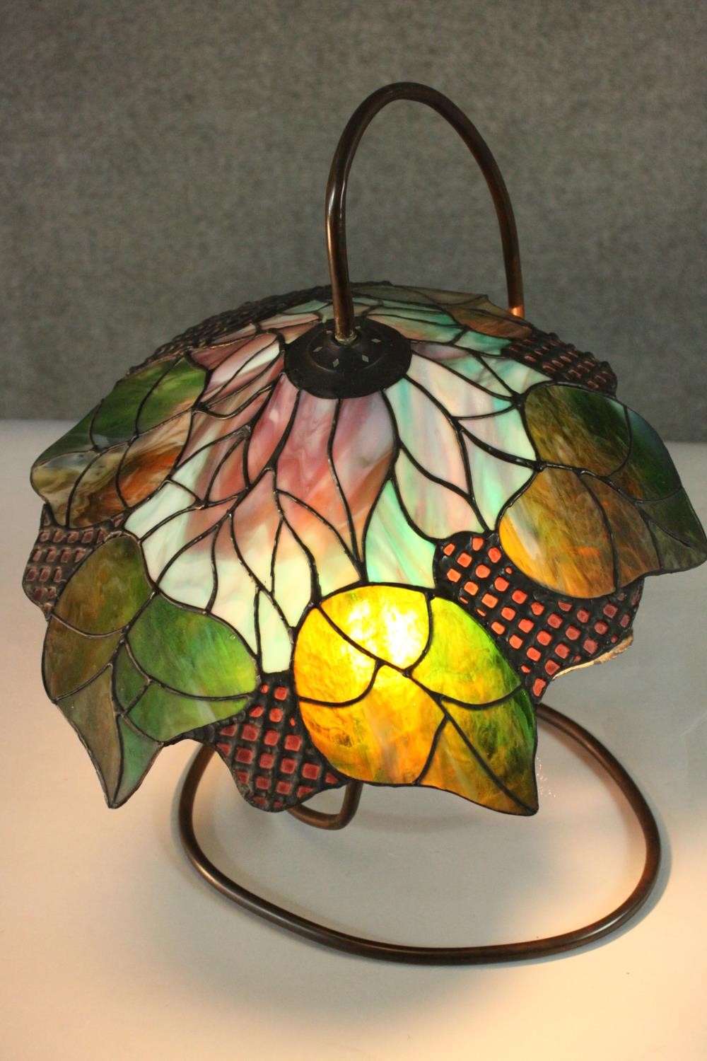 A Tiffany style stained glass table lamp, the shade with foliate design. H.48 W.40cm. - Image 4 of 8