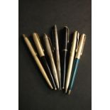 A collection of seven ballpoint and fountain pens, silver and gold plated, various makers such as