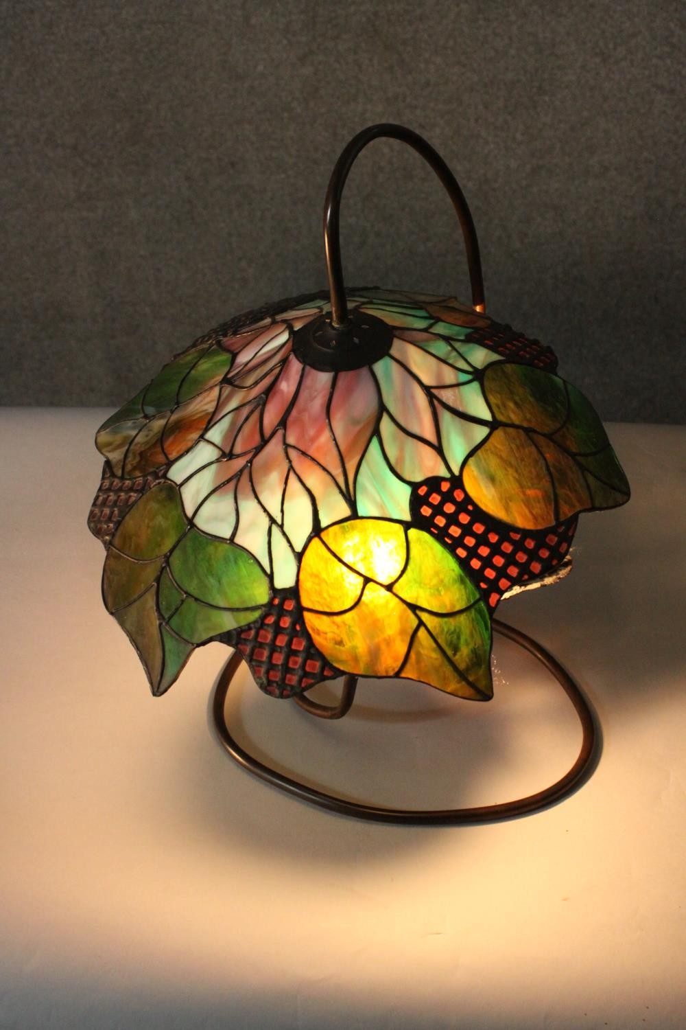 A Tiffany style stained glass table lamp, the shade with foliate design. H.48 W.40cm. - Image 5 of 8