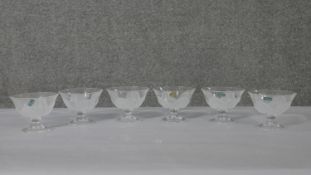 A boxed set of twelve glass Crystal D'Arques J.G. Durand flower bowls. H.9.5 Diam.12cm
