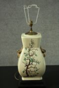 A Chinese style gilded twin handled vase, decorated with fruit blossom design table lamp. H.68cm