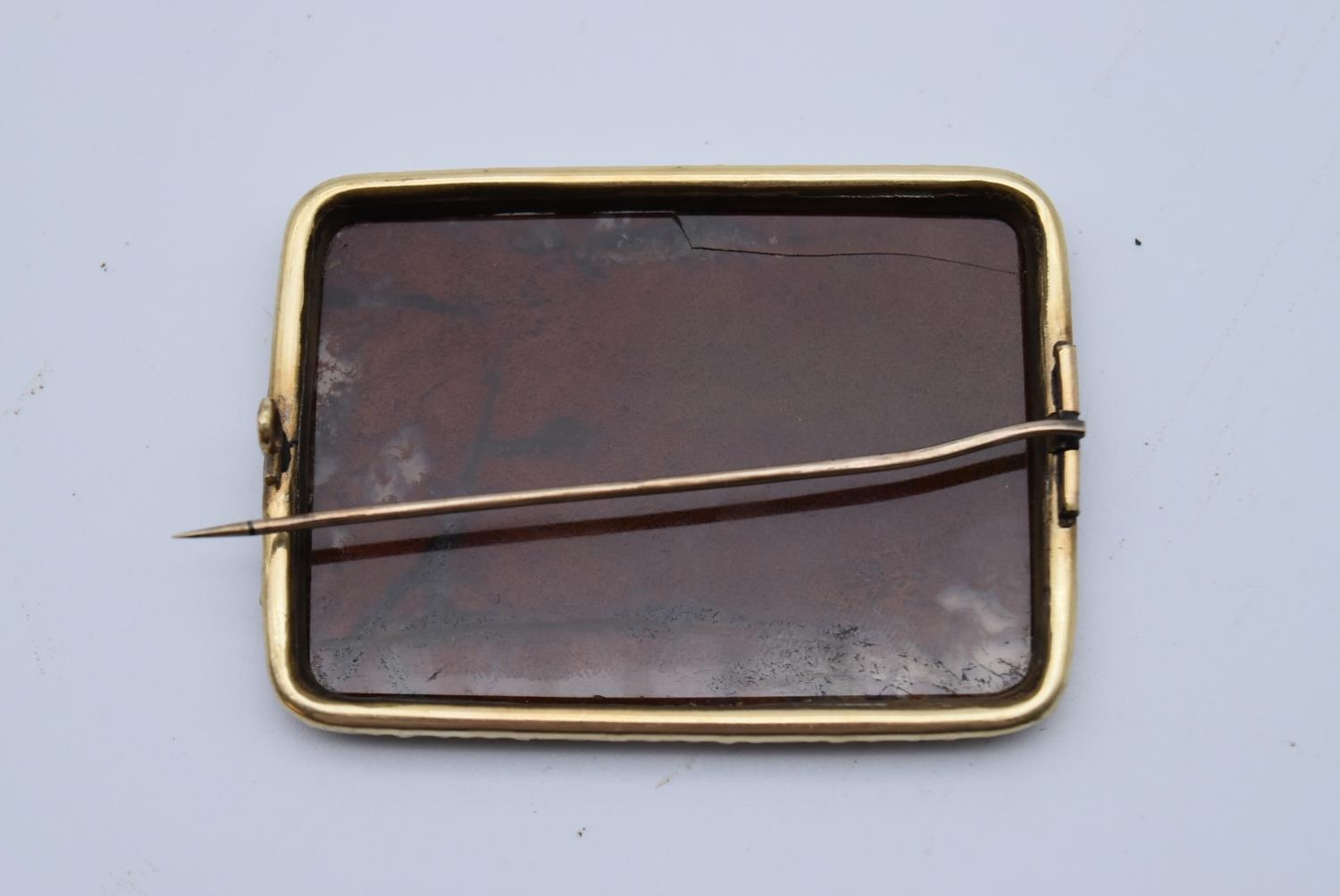 A Victorian yellow metal brooch set with a panel of red Jasper, in foliate form claws, hinged pin to - Image 3 of 5