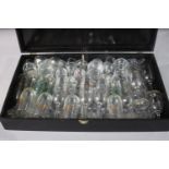 A boxed collection of stemmed drinking glasses, including Chambord. Various sizes.