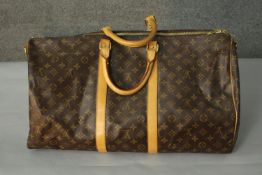 A Louis Vuitton "Keepall" 60, date code:MB1004 , Monogram canvas exterior with leather trim, dual