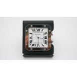 A stainless steel Cartier Santos travel alarm clock, model number 2750, Roman numerals to a