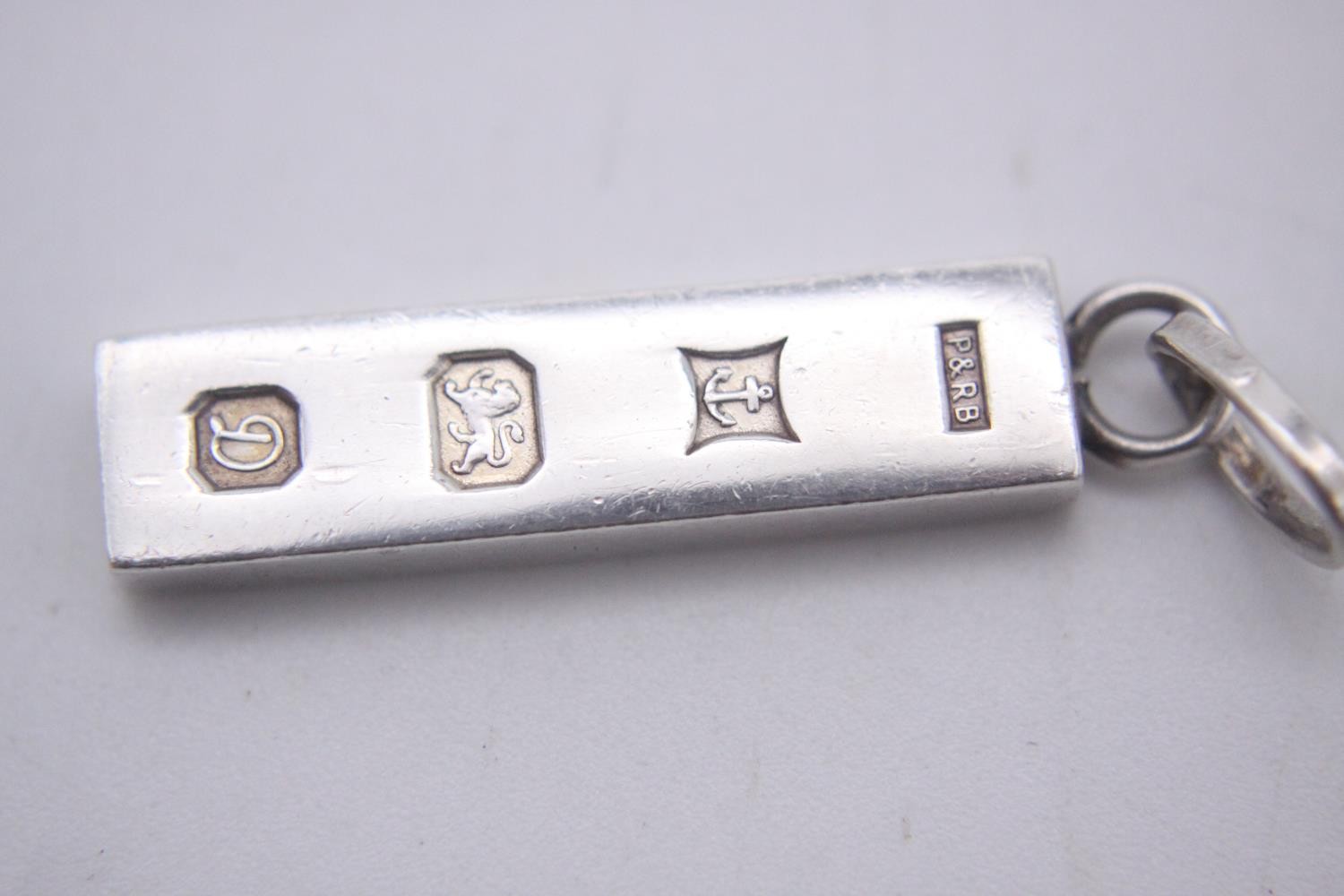 Three silver ingot pendants, each stamped to the front with a different set of hallmarks. Makers: - Image 3 of 10