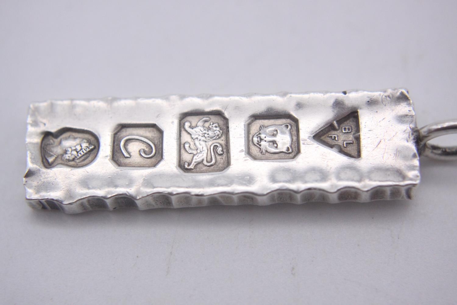 Three silver ingot pendants, each stamped to the front with a different set of hallmarks. Makers: - Image 4 of 10