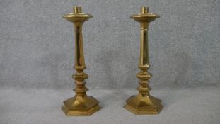 A pair of early 20th century hexagonal brass candlesticks. H.45 W.20 D.17cm