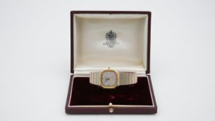A leather cased vintage Asprey bicolour metal steel gents watch with an octagonal design and