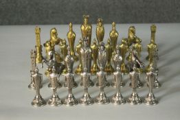 A 20th century Italfama gold and silver plated chess set with stylised pieces. Makers mark to the