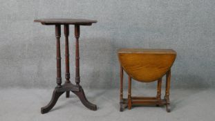 An oak drop leaf table of small proportions with turned legs, together with an occasional table with