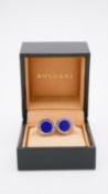 A boxed pair of Bulgari sterling silver and lapis cufflinks with engraved branding and whaleback