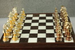A large Italfama gold and silver plated chess set and black and white marble inlaid chess board with