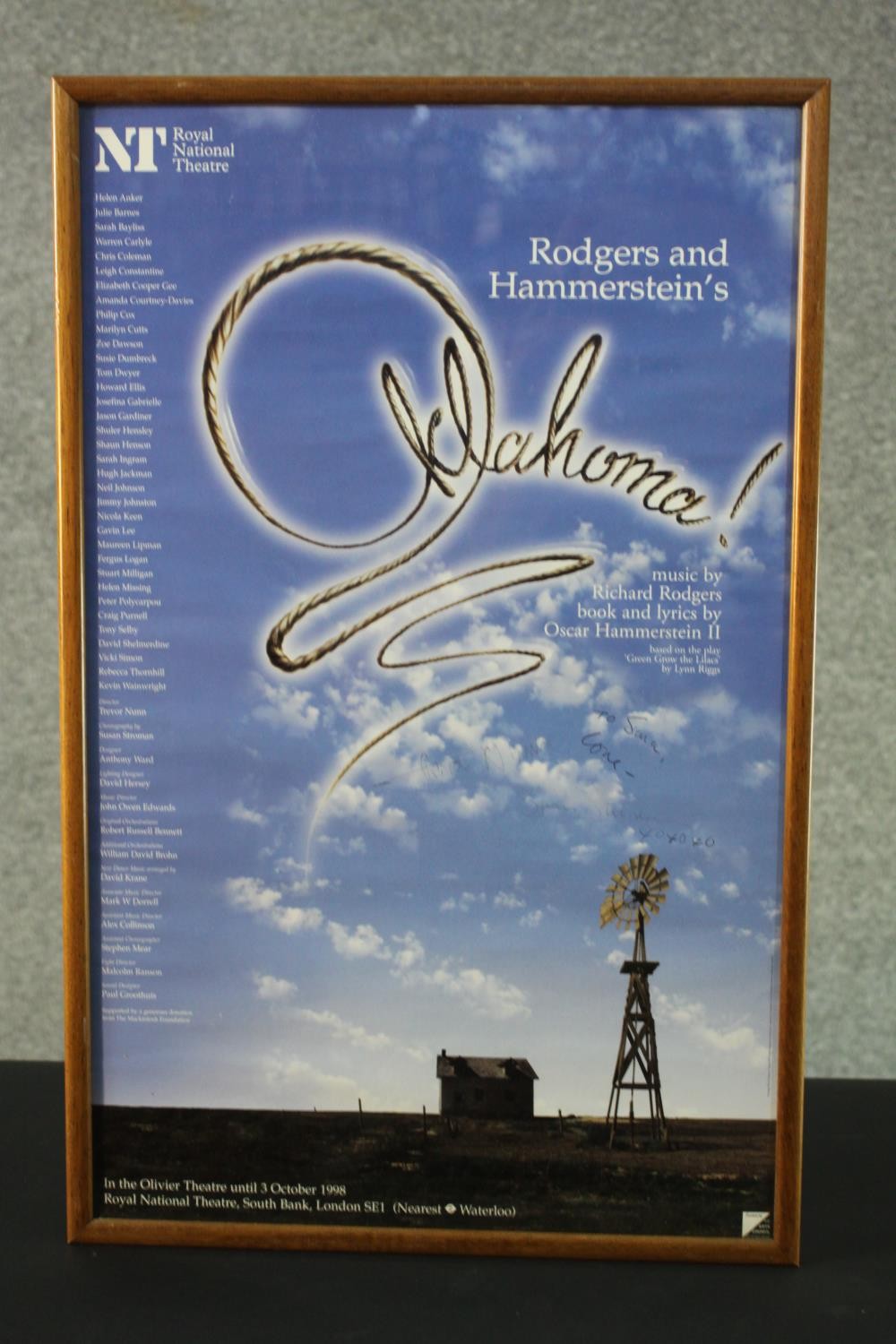 A framed and glazed signed Royal National Theatre Oklahoma poster. Signed by the Choreographer and