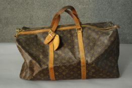 A Louis Vuitton "Keepall" 60, date code:FL0070 , Monogram canvas exterior with leather trim, dual