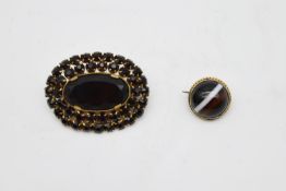 A gilt metal and black glass cluster brooch along with a Victorian gold plated and banded agate