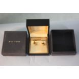 A cased pair of 18 carat yellow gold Bulgari B. Zero semicircular design cufflinks with impressed