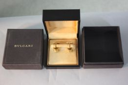 A cased pair of 18 carat yellow gold Bulgari B. Zero semicircular design cufflinks with impressed