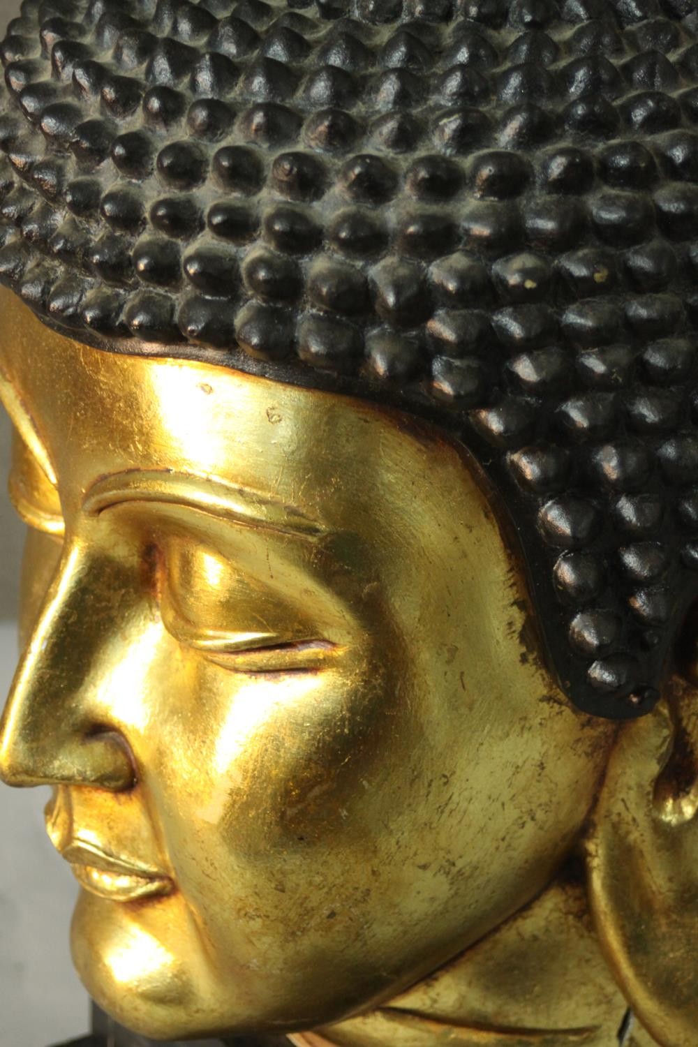 A 20th century gilded carved wooden Buddha head on a pedestal base. H.55 W.30cm. - Image 5 of 6