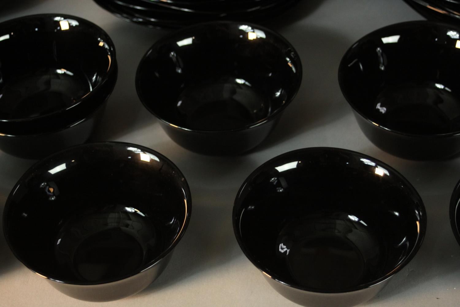 A twelve person black glass dinner service. Marked ARC, France to the base. - Image 3 of 7