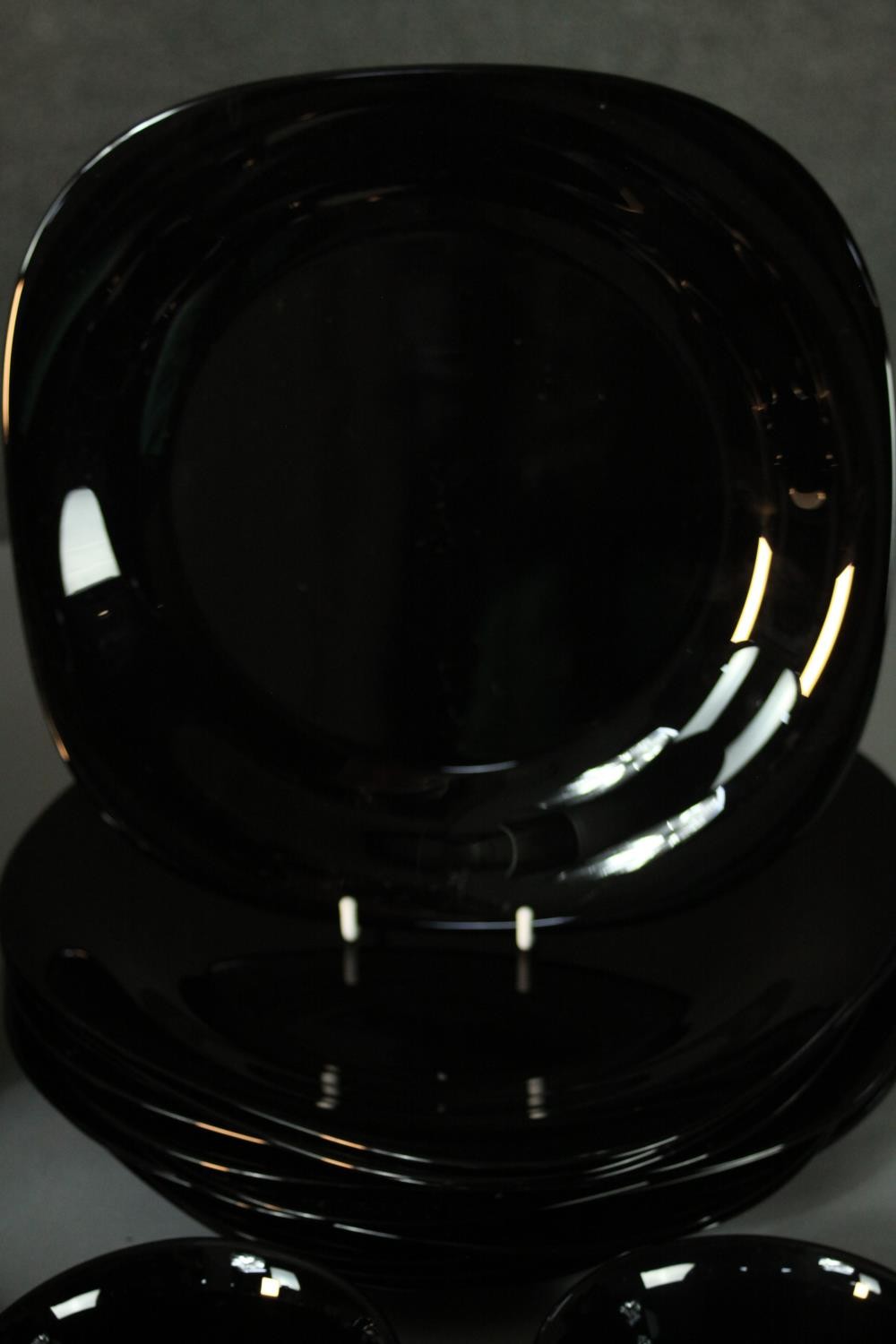 A twelve person black glass dinner service. Marked ARC, France to the base. - Image 2 of 7