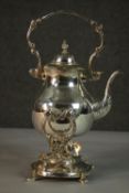 A Victorian engraved silver plated spirit kettle on stand with burner. H.30 W.17cm.