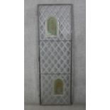 A large early 20th century lead and stained glass door with two painted coloured glass panels with