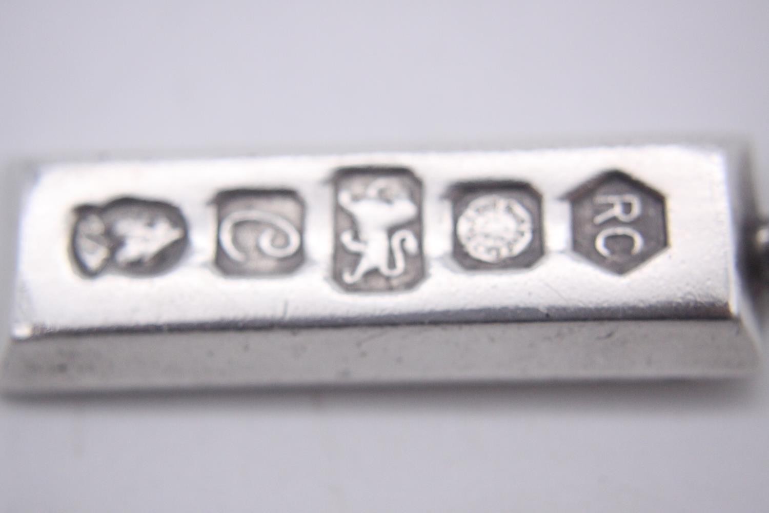 Three silver ingot pendants, each stamped to the front with a different set of hallmarks. Makers: - Image 8 of 10
