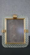 An early 20th century cane glass and gilt metal easel photo frame. H.33 D.28cm (largest)