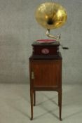 A Sound Master gramophone, with a brass horn and winder. Together with an Edwardian mahogany bedside
