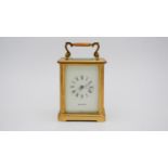 A gilt brass early 20th century carriage clock by Mappin & Webb, white enamel dial with roman