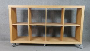 Bookcase, contemporary open shelves on wheeled casters. H.97 W.162 D.36cm