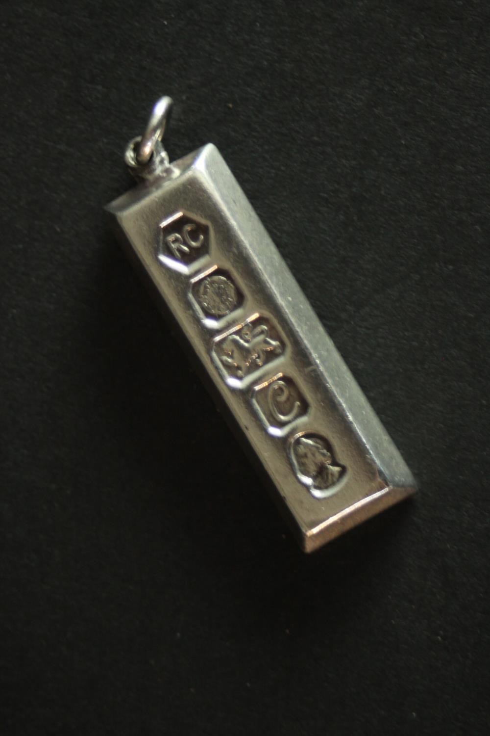 Three silver ingot pendants, each stamped to the front with a different set of hallmarks. Makers: - Image 5 of 10