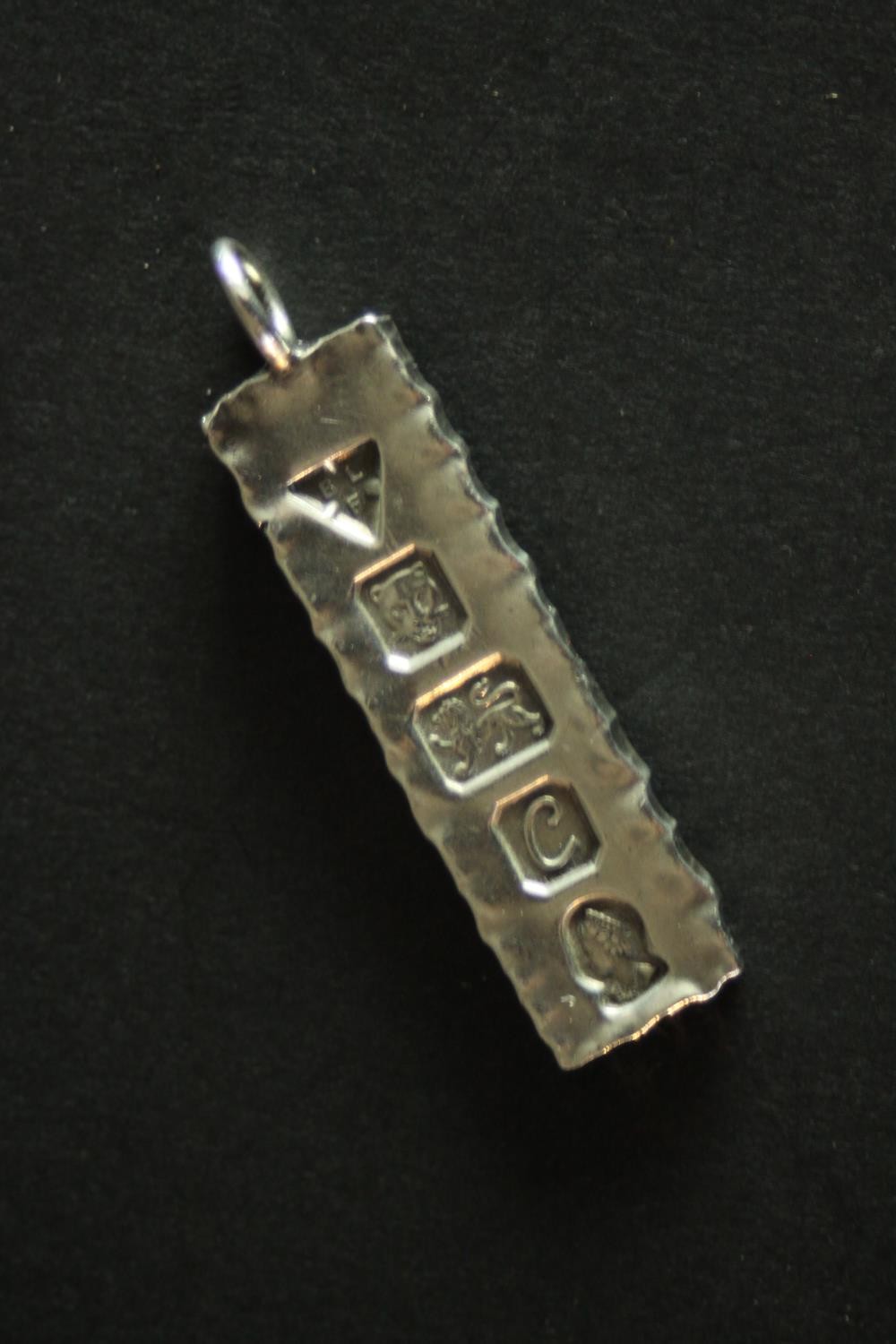 Three silver ingot pendants, each stamped to the front with a different set of hallmarks. Makers: - Image 6 of 10