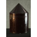 A Chinese Mandarin early 20th century lacquered conical design hat box with brass fittings. H.40
