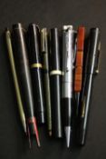 A collection of eight vintage fountain and ballpoint pens, including a novelty Ronson lighter pen, a