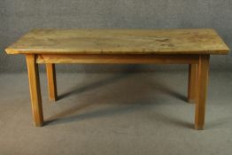 A contemporary burr elm refectory dining table, the rectangular top with chamfered edges on
