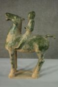 A Chinese Tang style green glaze clay horse and rider on rectangular base. H.69 W.53cm.