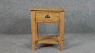 A contemporary beech butchers block, the single drawer with a cup handle which opens from both