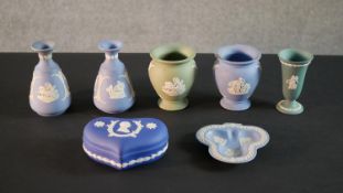 A collection of seven Wedgwood pieces, including a dark blue Jasperware commemorative box, a pair of