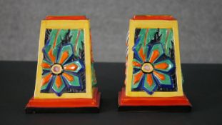 A pair of Art Deco Clarice Cliff shape 406 book ends, relief moulded with stylised abstract